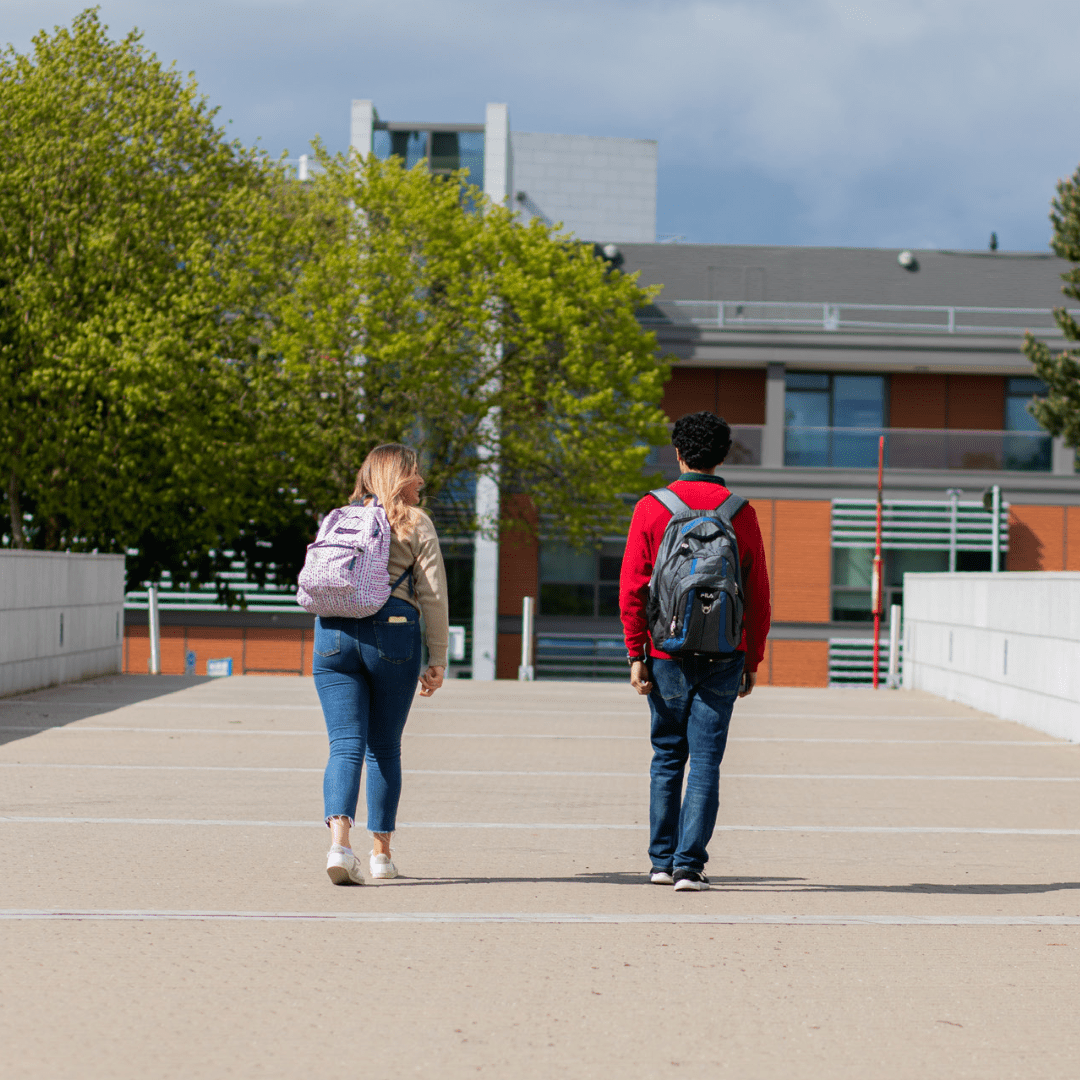 Two students walking away on a college campus for the Access College website banner.