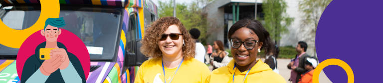 Two women standing outside a college next to a bus.